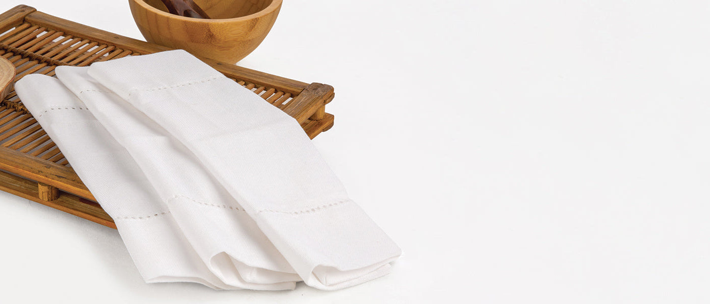 Elegant cotton and linen cocktail napkins in classic white, perfect for parties and events. Elegant cotton and linen cocktail napkins in classic white, perfect for parties and events.