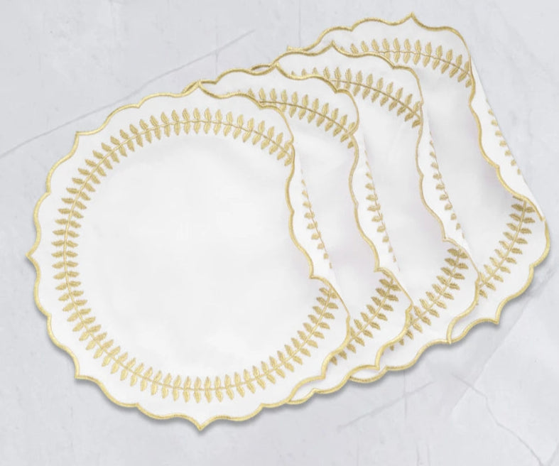 Elegant dining setup featuring round table with placemats Elegant dining setup featuring round table with placemats