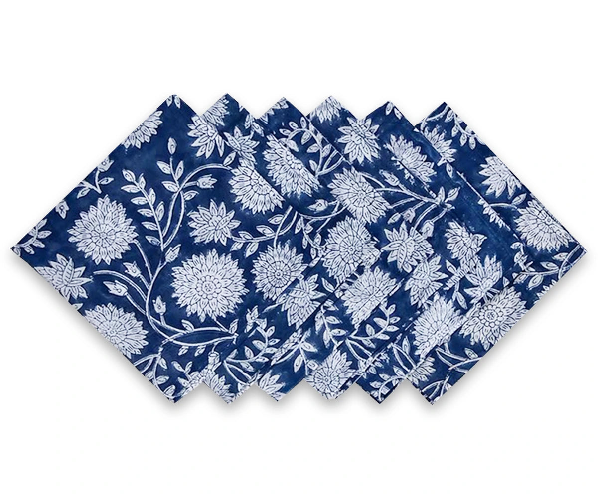 Set of blue floral cotton cloth napkins with white flower print, neatly arranged – perfect reusable floral fabric napkins for dining or events.
 Set of blue floral cotton cloth napkins with white flower print, neatly arranged – perfect reusable floral fabric napkins for dining or events.
