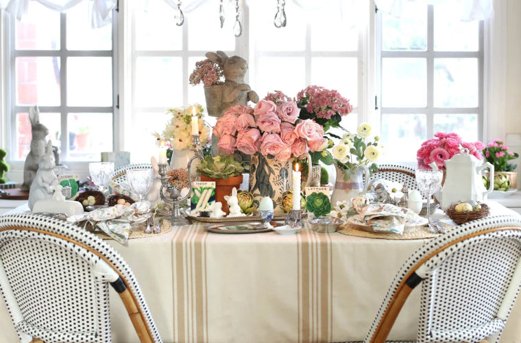 Farmhouse tablecloth with floral centerpieces and spring decor. Farmhouse tablecloth with floral centerpieces and spring decor.