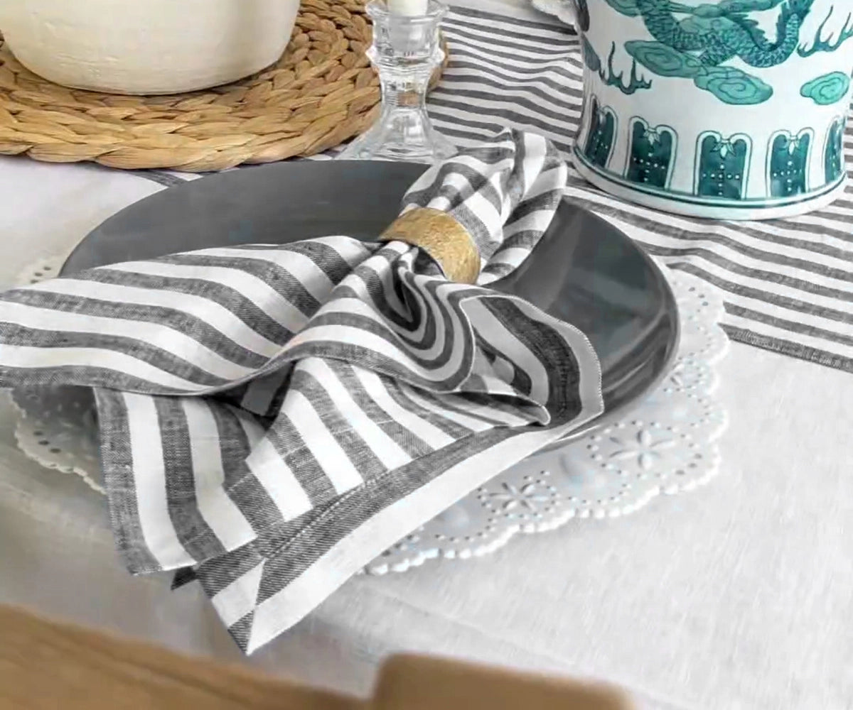 Black and white cloth napkins set the table for a modern dinner party Black and white cloth napkins set the table for a modern dinner party