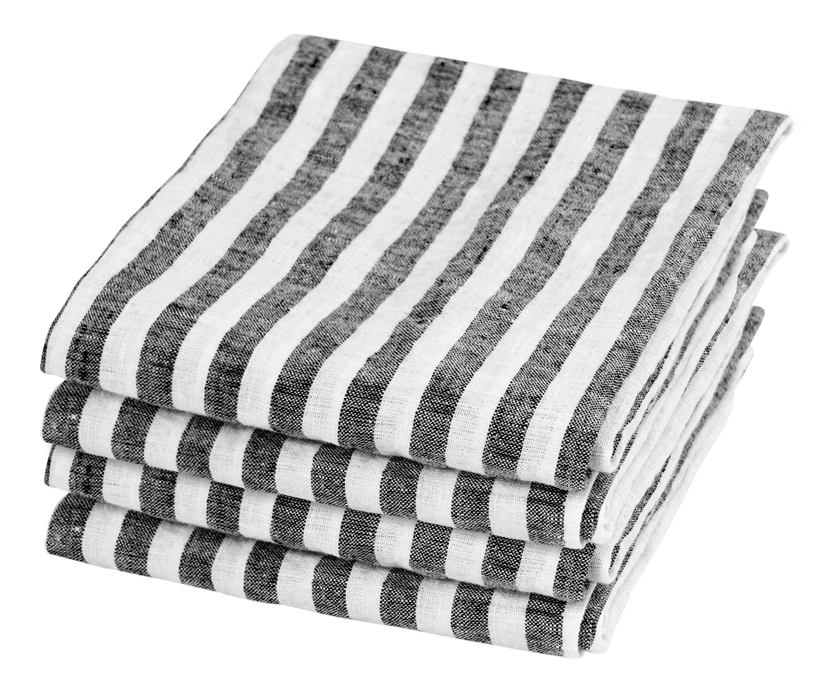 Black linen napkins set the table for a dinner party Black linen napkins set the table for a dinner party