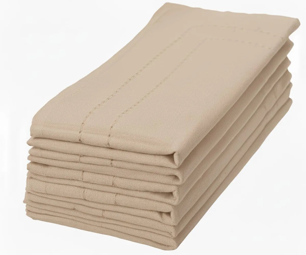 Beige double-hemstitched cotton napkin offering a neutral, timeless look for weddings or everyday dining. Beige double-hemstitched cotton napkin offering a neutral, timeless look for weddings or everyday dining.