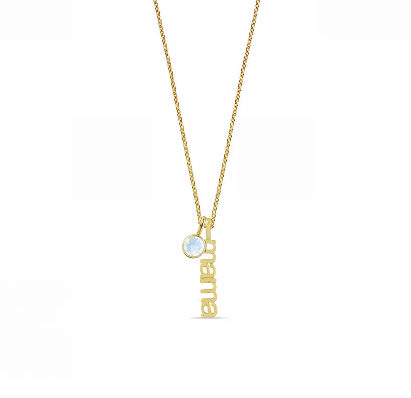 Close-up of gold plated mama pendant Close-up of gold plated mama pendant