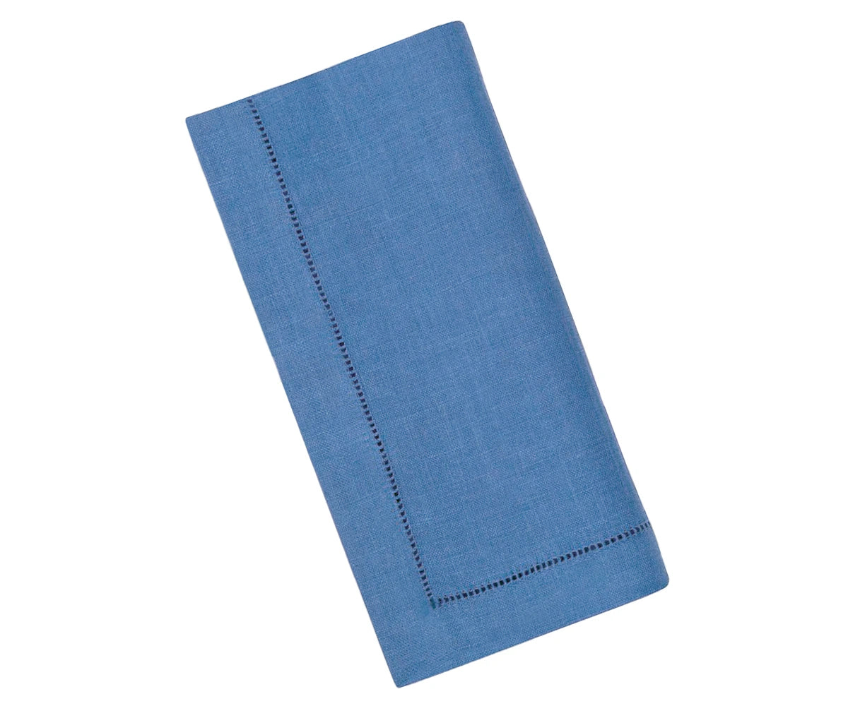 Elegant blue hemstitched linen napkins placed on a table setting – 100% pure linen for refined dining. Elegant blue hemstitched linen napkins placed on a table setting – 100% pure linen for refined dining.