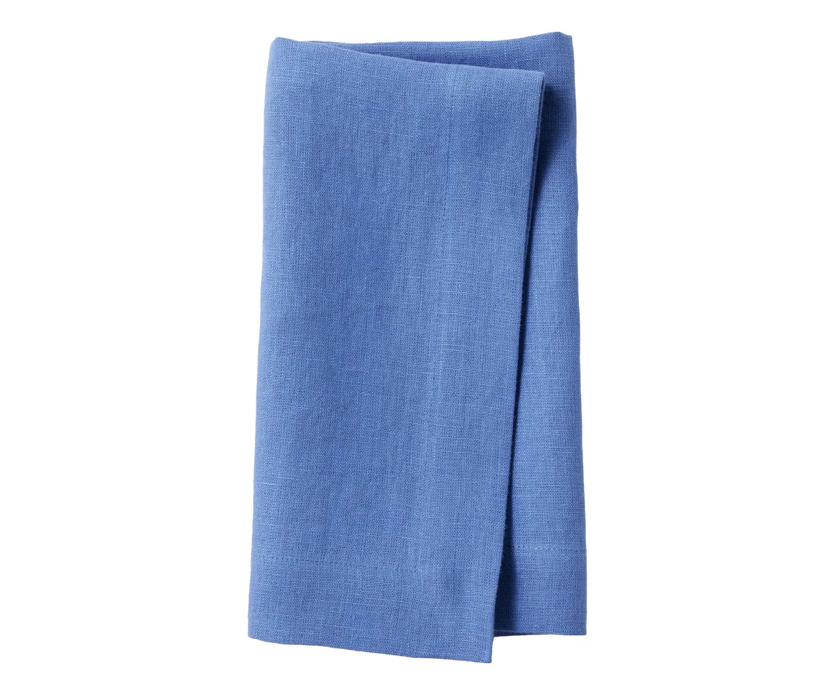 Elegant red linen napkins arranged for a formal table setting Elegant red linen napkins arranged for a formal table setting