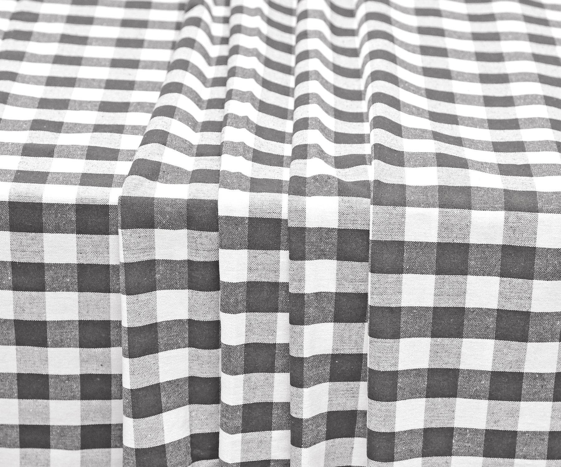 Classic gingham checkered plaid tablecloth, a staple for farmhouse decor.