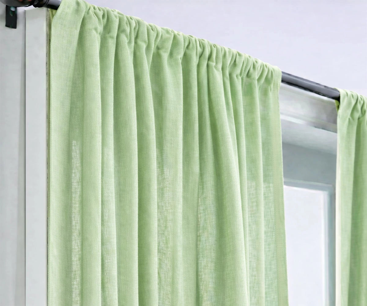 Matcha green linen curtains creating a soothing, nature-inspired living room ambiance, made from eco-friendly linen with soft light filtering. Matcha green linen curtains creating a soothing, nature-inspired living room ambiance, made from eco-friendly linen with soft light filtering.
