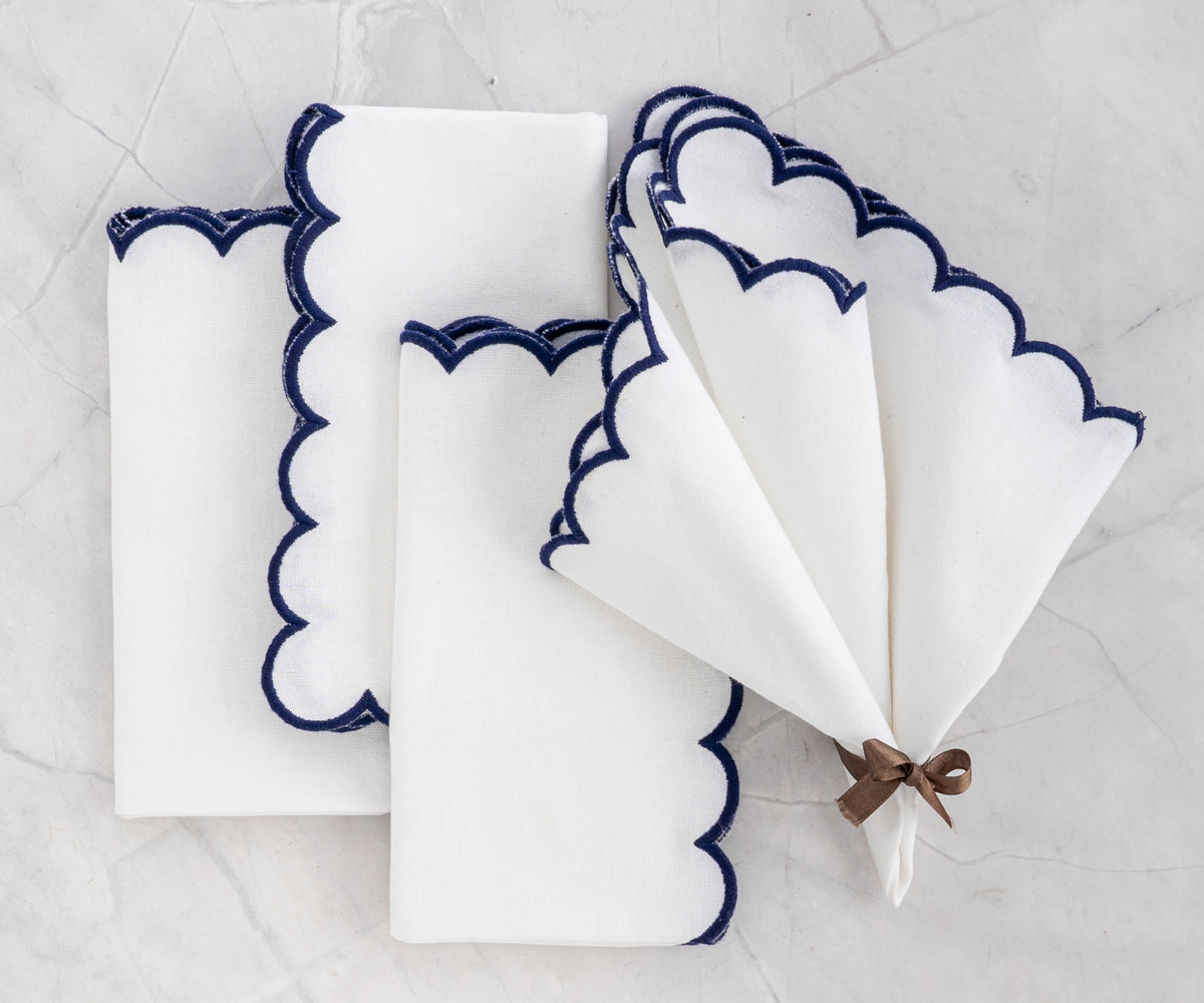 Overhead view of scalloped napkins folded into a triangle Overhead view of scalloped napkins folded into a triangle