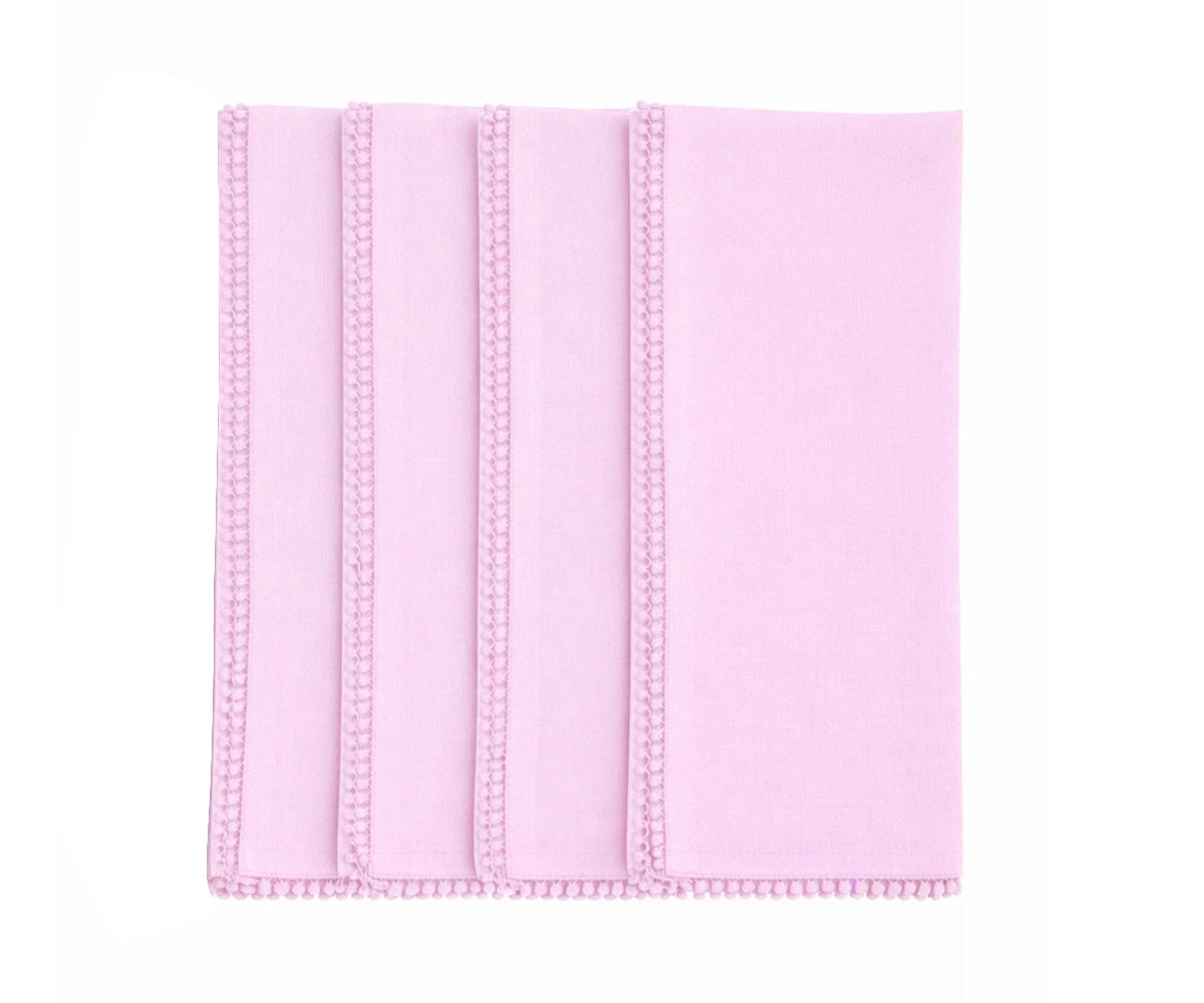 Pastel pink cotton napkin with knotted pom pom trim Pastel pink cotton napkin with knotted pom pom trim