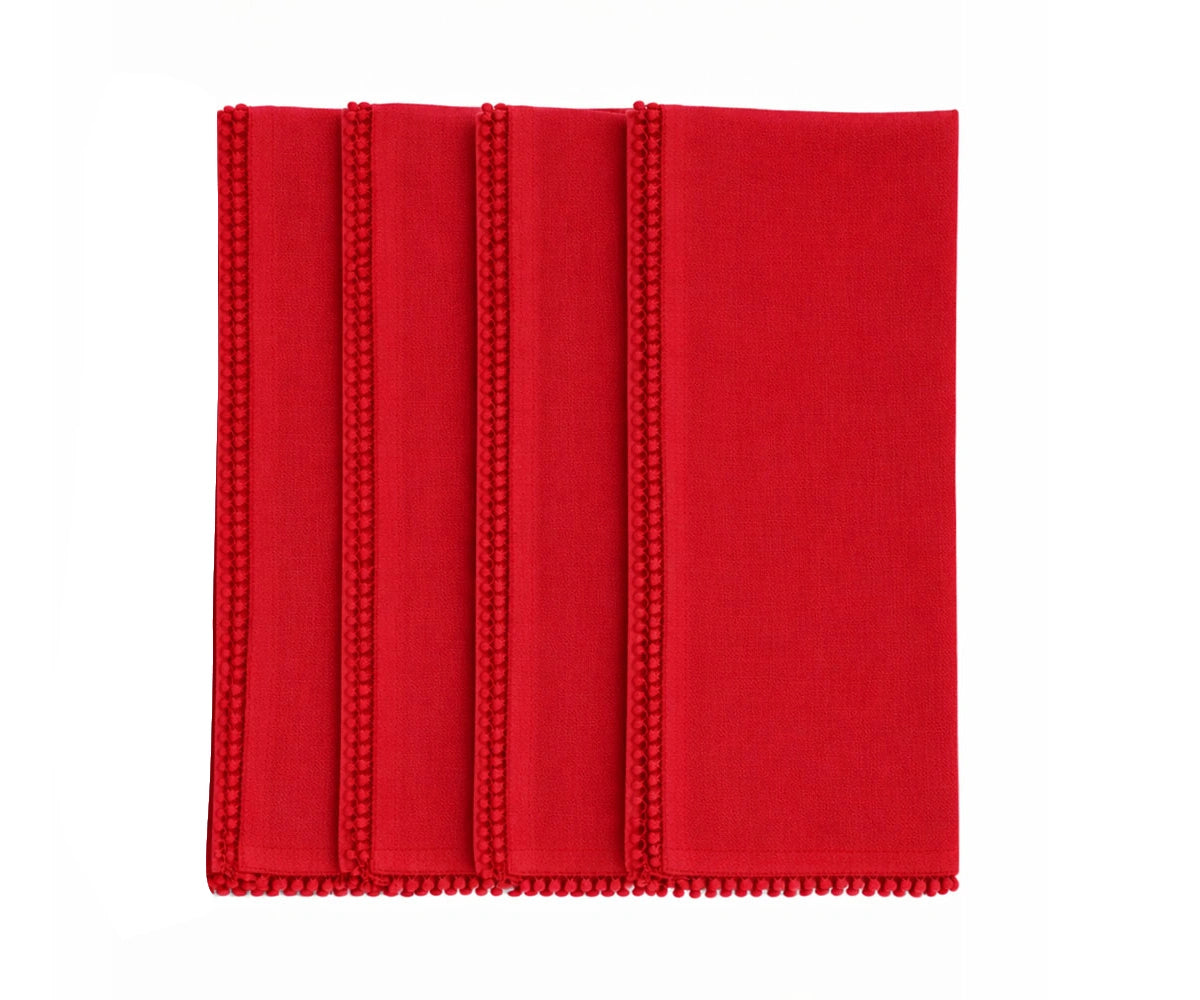 Red cotton pom pom napkin for holiday and dinner table décor Red cotton pom pom napkin for holiday and dinner table décor