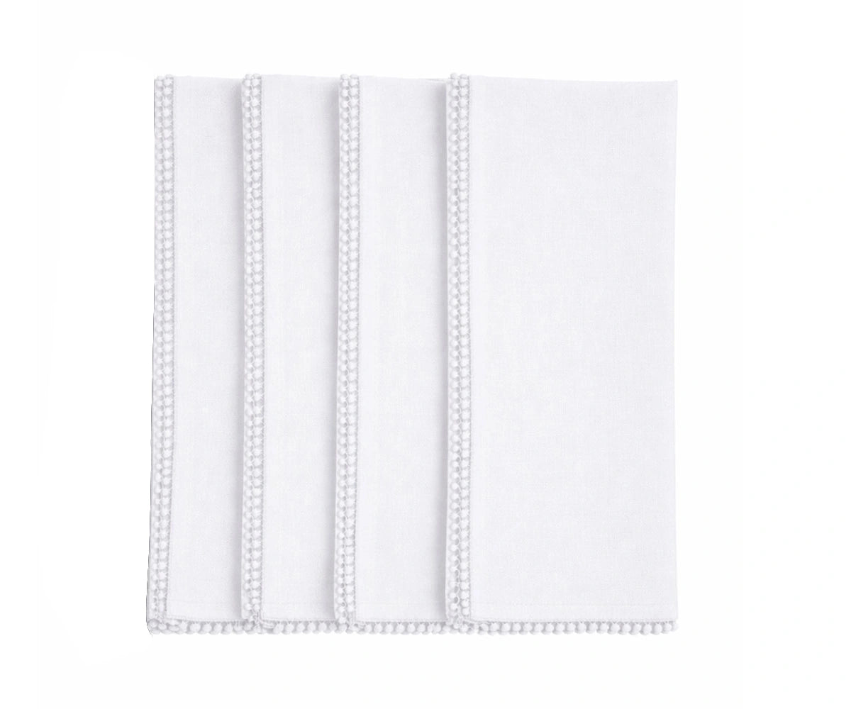 White cotton pom pom napkin with decorative trim White cotton pom pom napkin with decorative trim