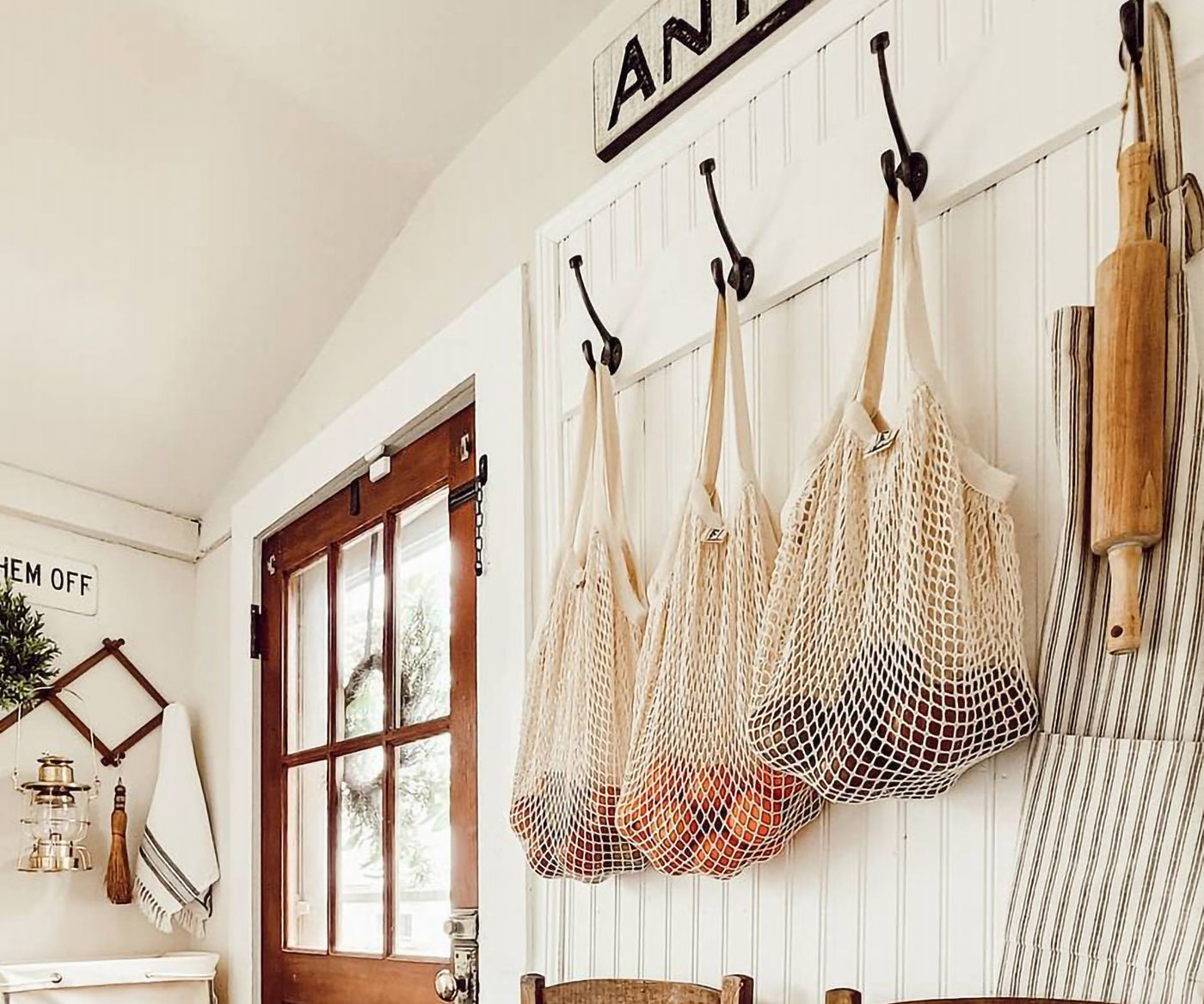 String produce bag hanging in a rustic kitchen setting with wooden accents String produce bag hanging in a rustic kitchen setting with wooden accents