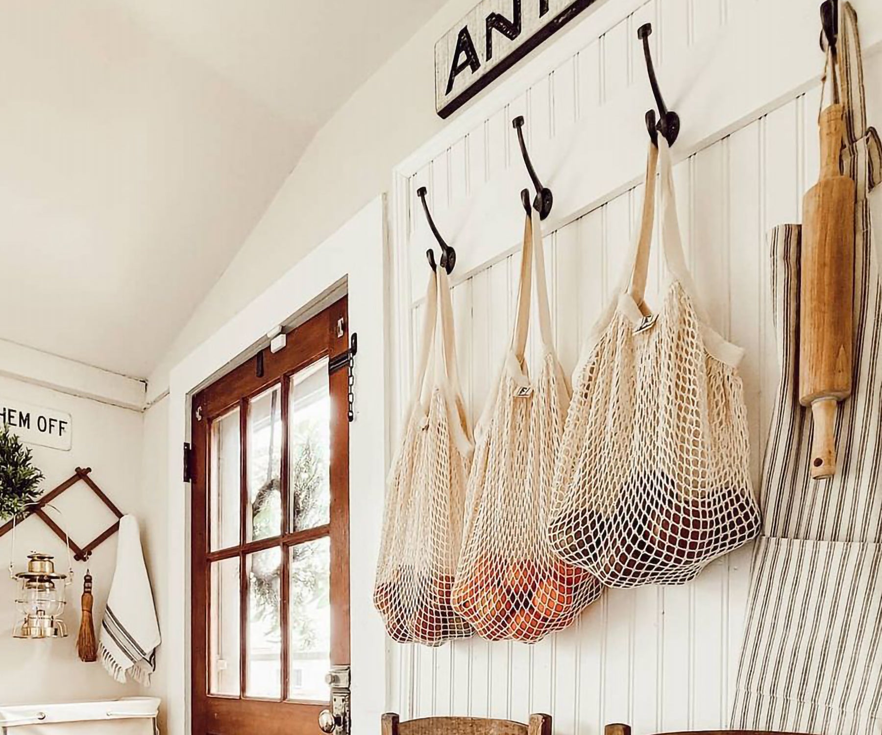 String produce bag hanging in a rustic kitchen setting with wooden accents String produce bag hanging in a rustic kitchen setting with wooden accents