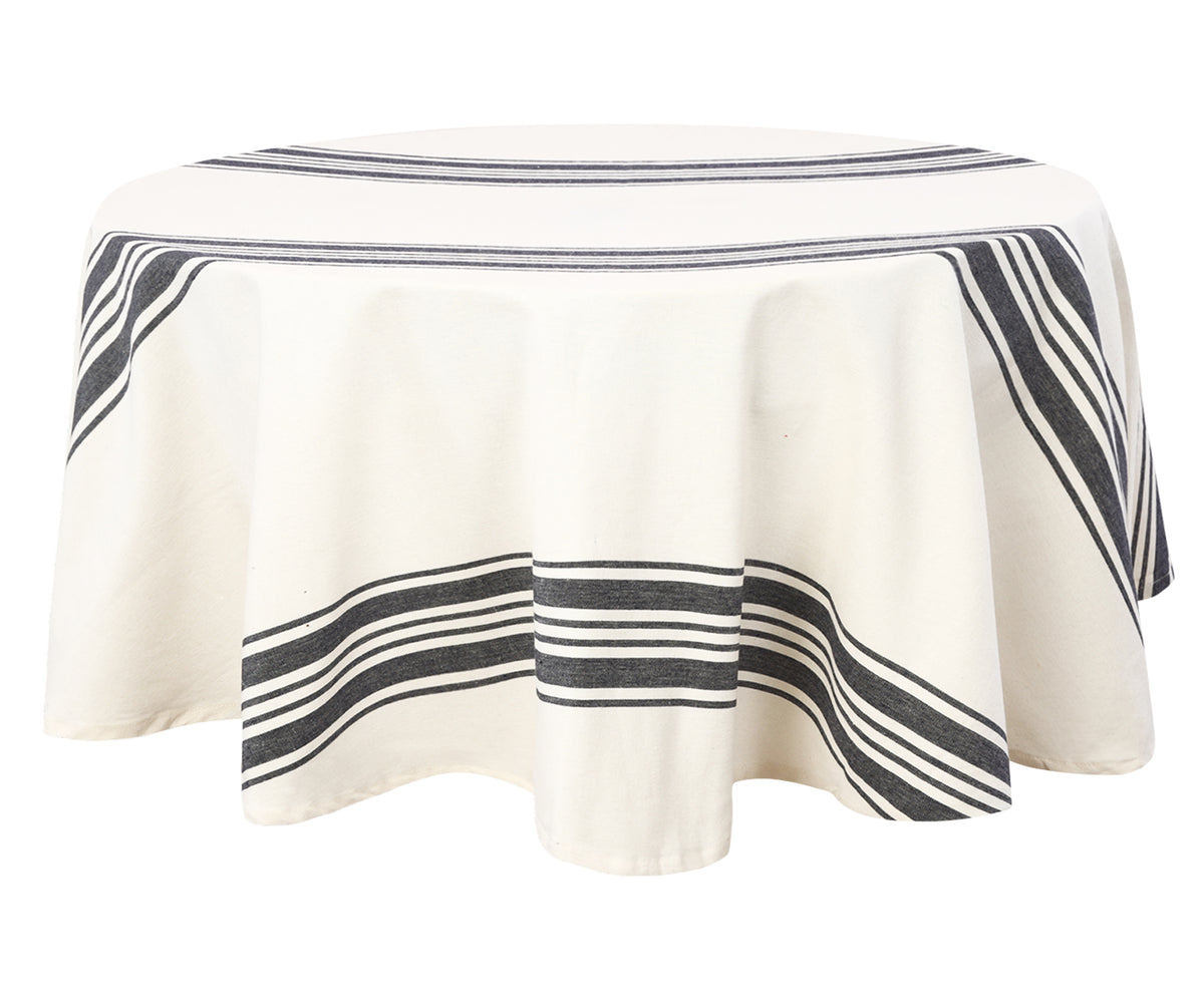 A farmhouse ticking tablecloth, designed for a round table. A farmhouse ticking tablecloth, designed for a round table.