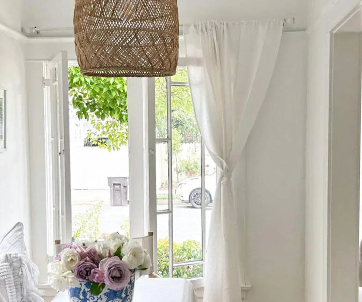 White 100% linen curtains with subtle stripe detail, styled in a bright living room White 100% linen curtains with subtle stripe detail, styled in a bright living room