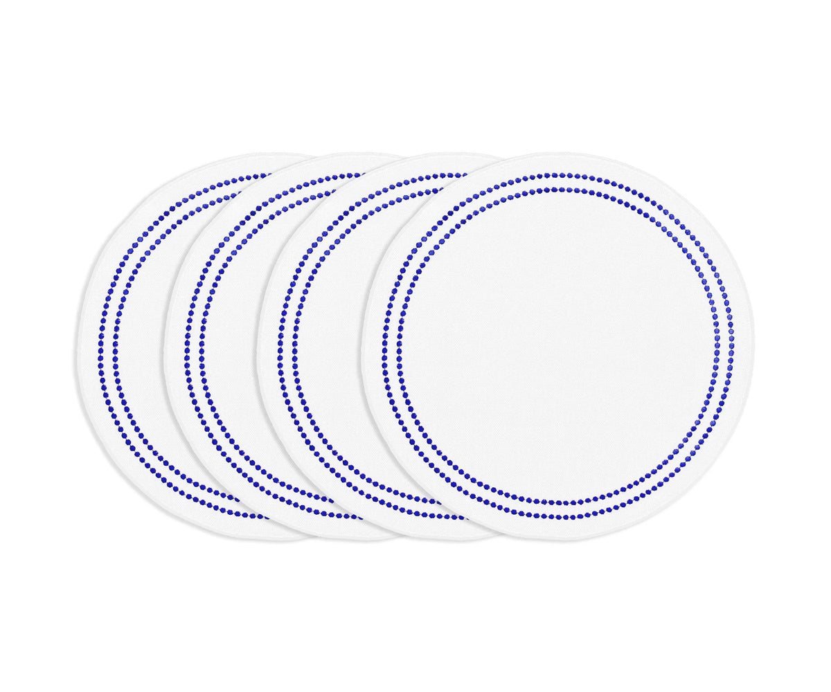 Royal blue round cotton placemat with white embroidery and pearl accents, stylish washable embroidered dining accessory. Royal blue round cotton placemat with white embroidery and pearl accents, stylish washable embroidered dining accessory.