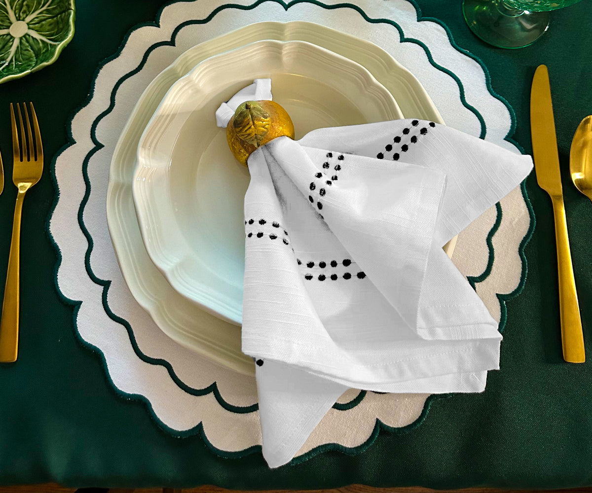 Cloth dinner napkins, such as cotton ones, can be elegantly folded using various techniques.  Cloth dinner napkins, such as cotton ones, can be elegantly folded using various techniques.