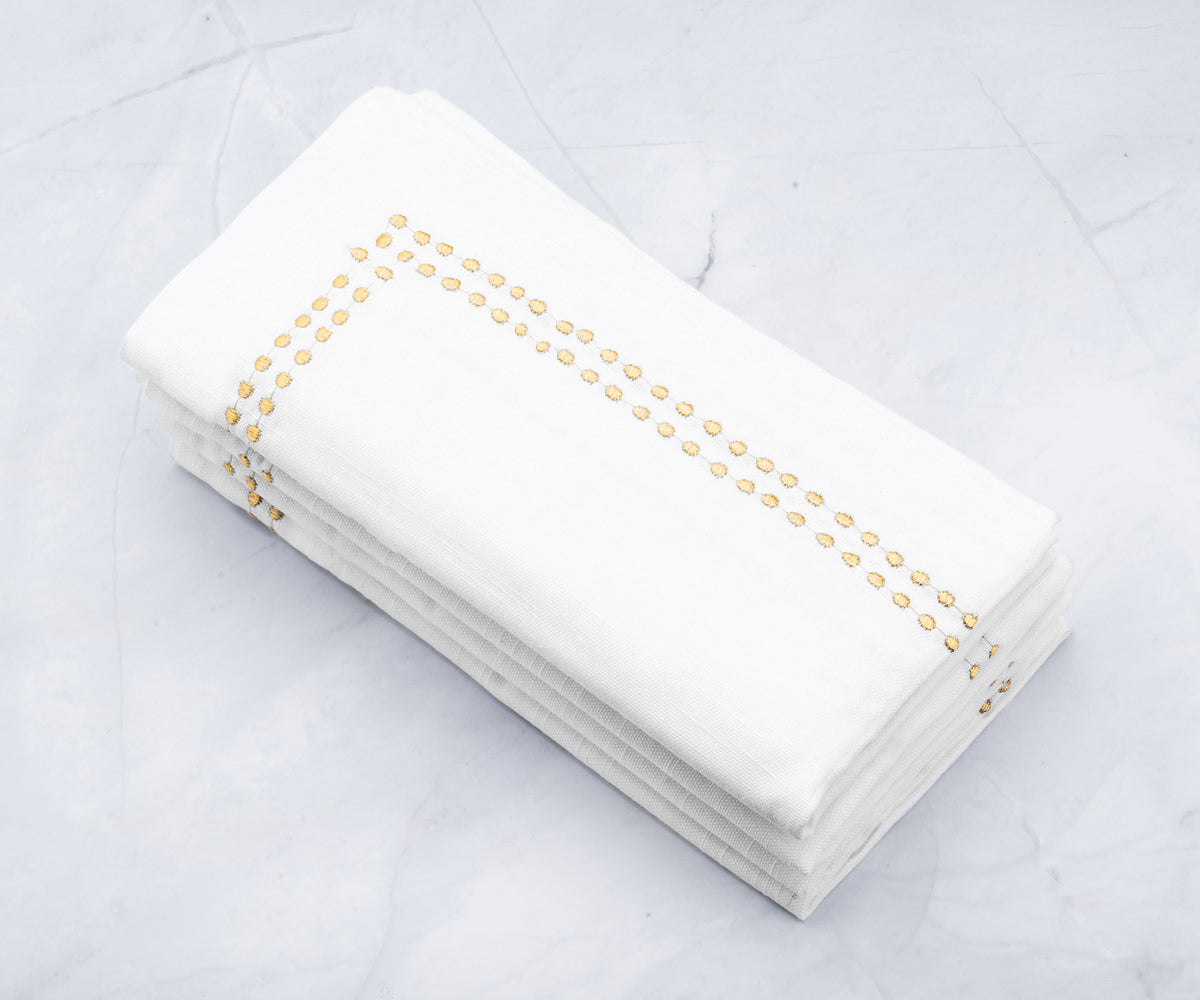 Crisp white dinner napkins, perfect for elegant table settings and special occasions.