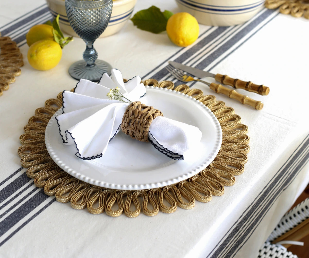 Striped tablecloth styled on a round table for party decoration Striped tablecloth styled on a round table for party decoration