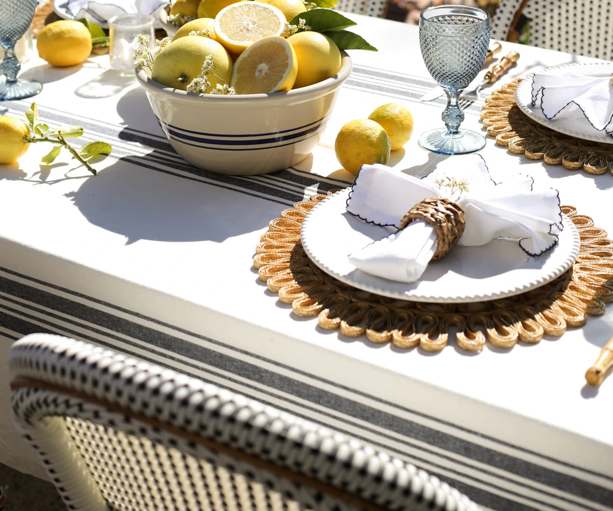 Rectangle striped tablecloth arranged for a family dinner setting Rectangle striped tablecloth arranged for a family dinner setting