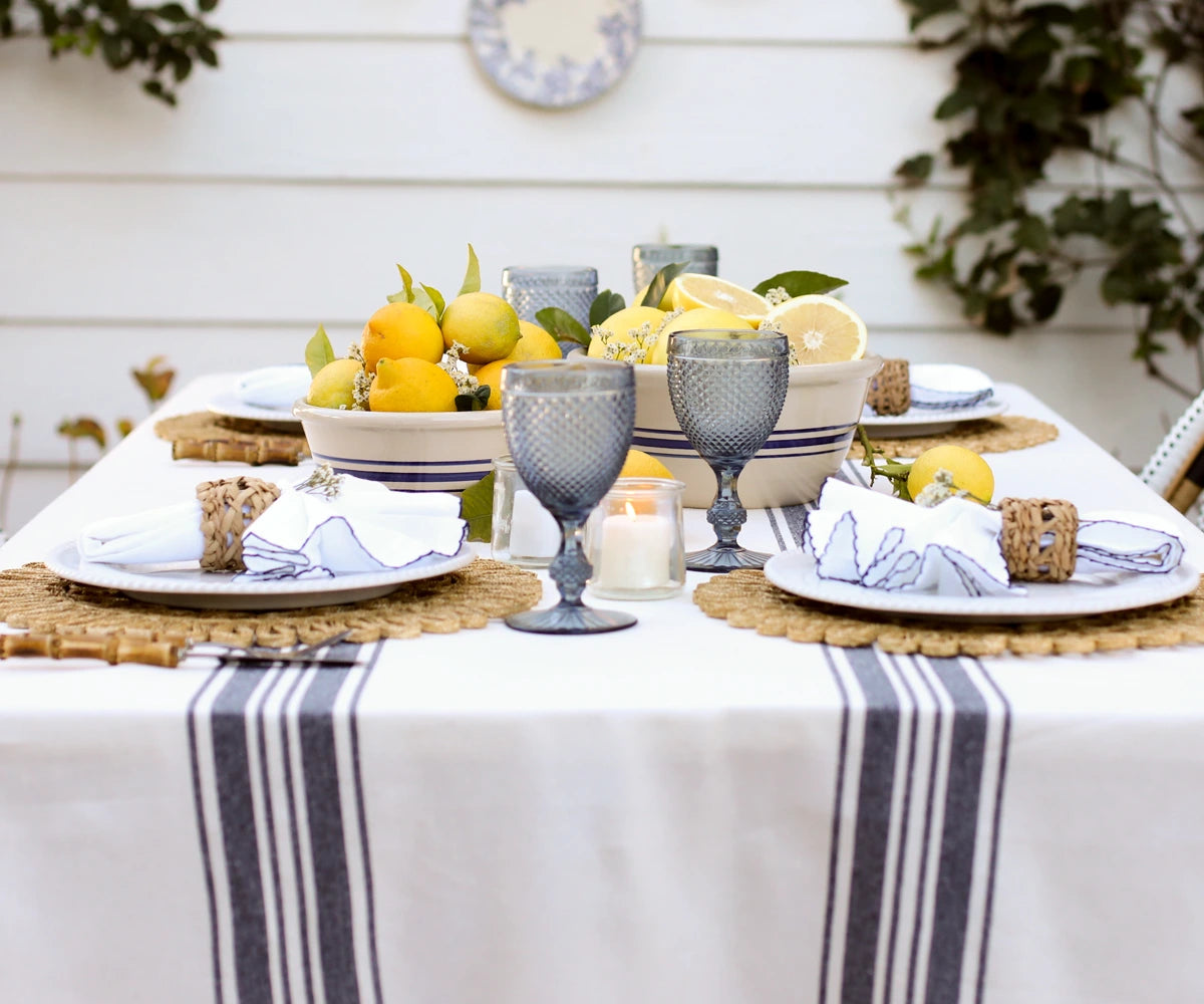 Striped tablecloth neatly spread on a dining table for everyday meals Striped tablecloth neatly spread on a dining table for everyday meals