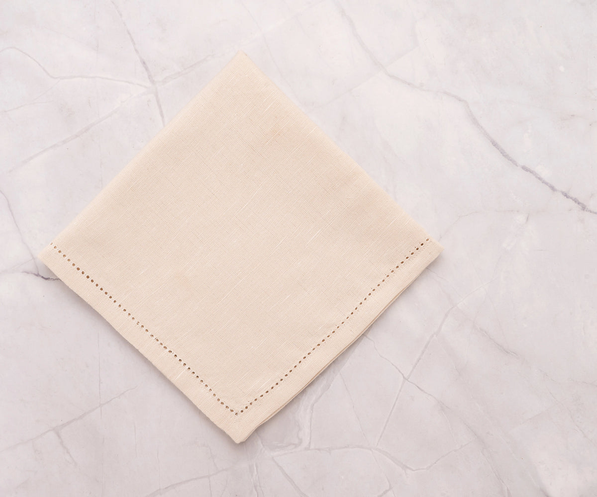 natural beige hemstitched napkin showing fine stitching detail natural beige hemstitched napkin showing fine stitching detail