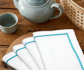 Dusty blue napkins, evoking a sense of tranquility and elegance.