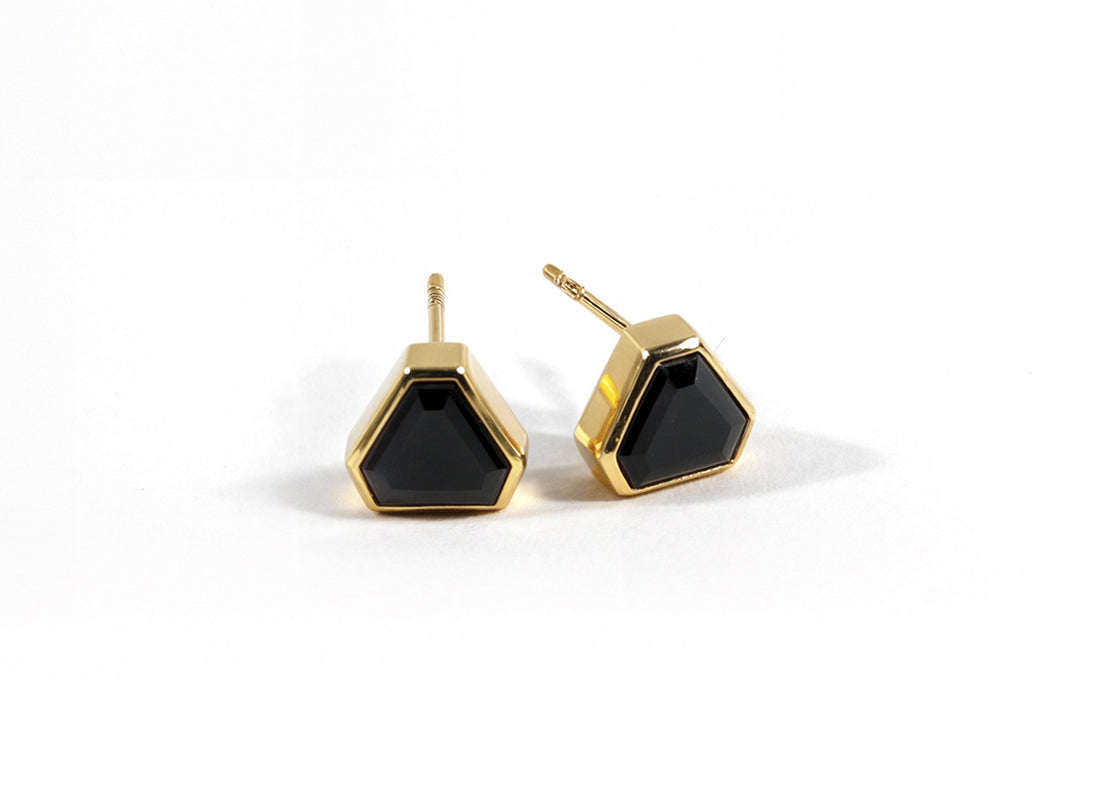 Elegant black onyx earrings with 18k yellow gold plating and secure push-back closure. Elegant black onyx earrings with 18k yellow gold plating and secure push-back closure.