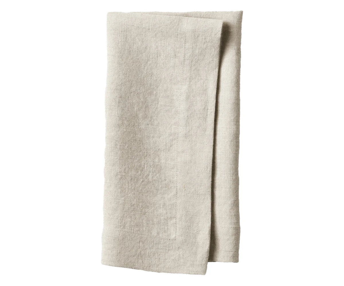 Folded flax  linen napkins stacked with tableware Folded flax  linen napkins stacked with tableware