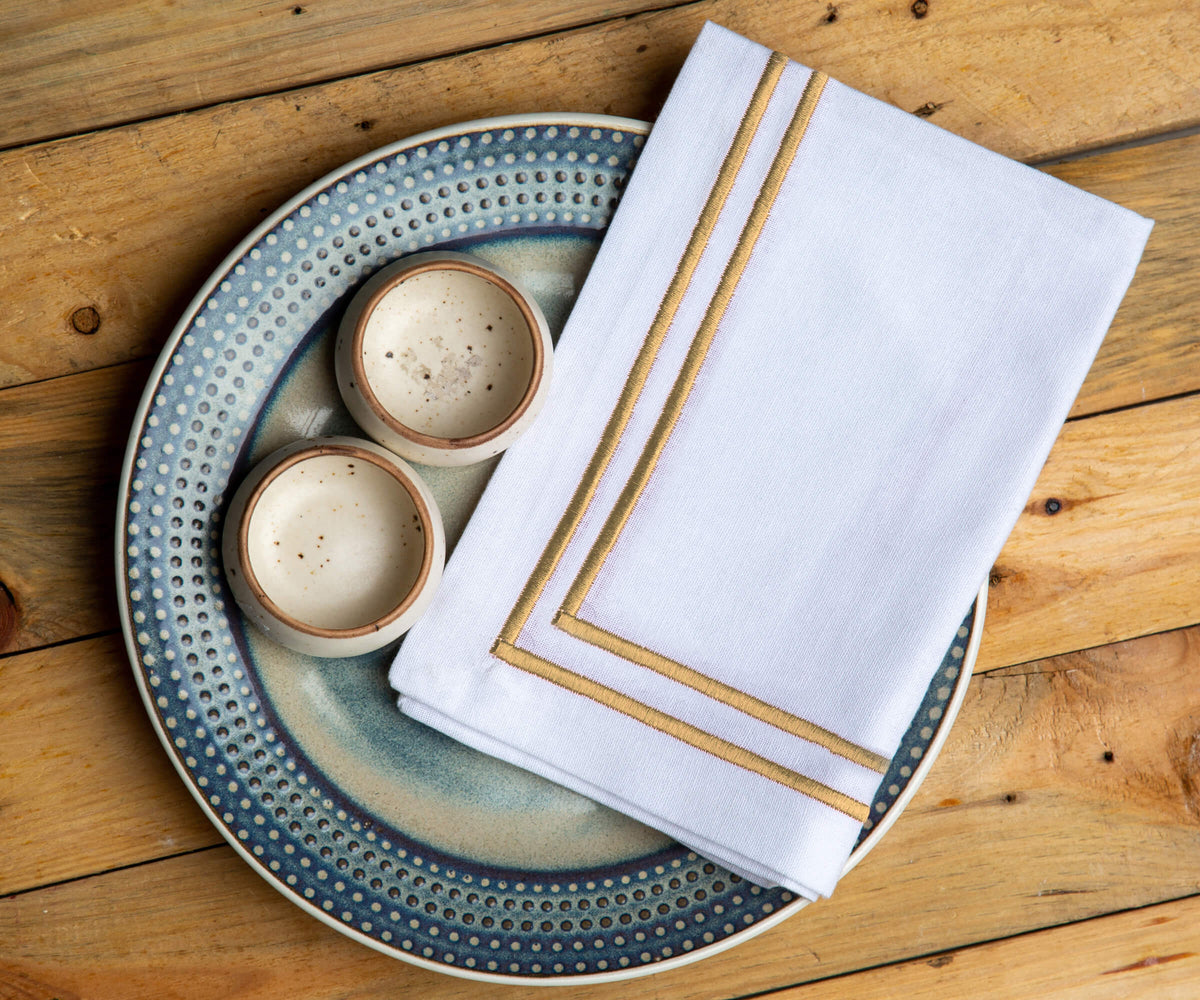 White napkin with a refined decorative trim White napkin with a refined decorative trim