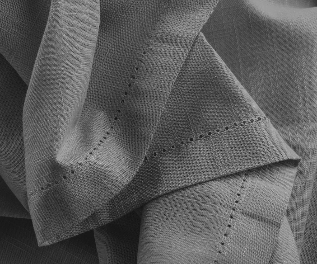 Gray cotton hemstitch tablecloth paired with matching napkins Gray cotton hemstitch tablecloth paired with matching napkins