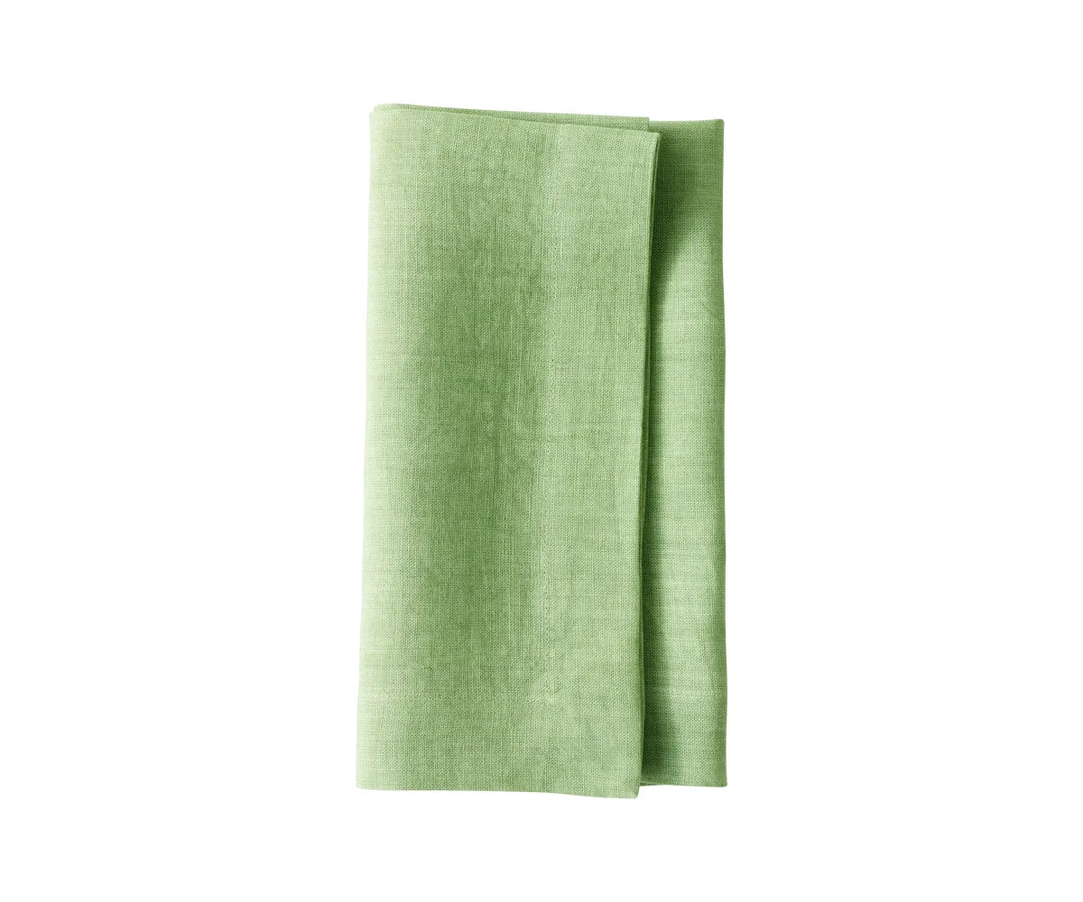 Signature linen napkins neatly folded on a dinner plate Signature linen napkins neatly folded on a dinner plate