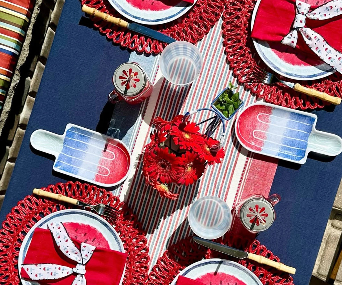 Red single hemstitch napkins neatly folded, showcasing fine stitching detail on the edges Red single hemstitch napkins neatly folded, showcasing fine stitching detail on the edges