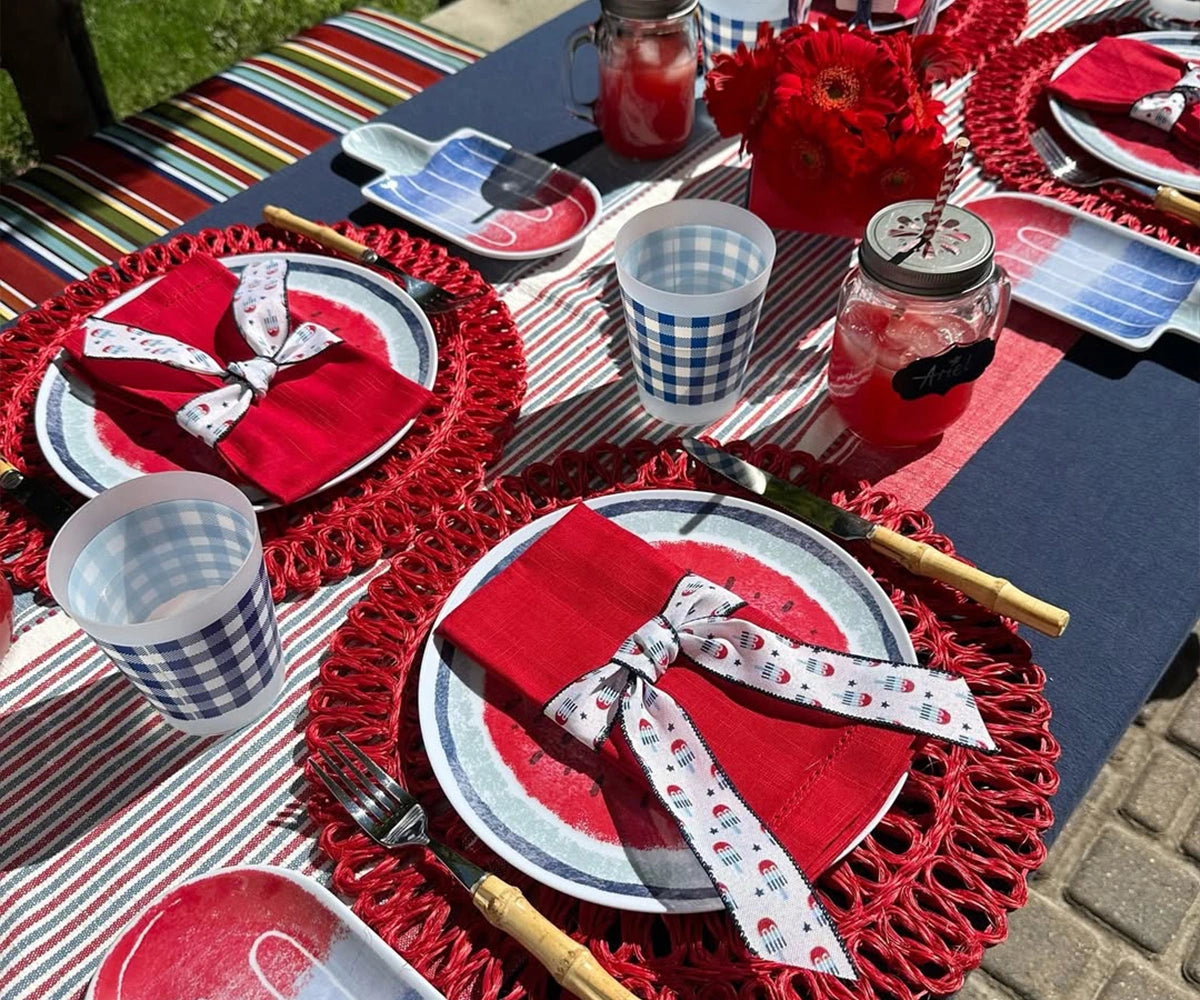 Close-up of red single hemstitch napkins highlighting the smooth cotton fabric and stitched border Close-up of red single hemstitch napkins highlighting the smooth cotton fabric and stitched border