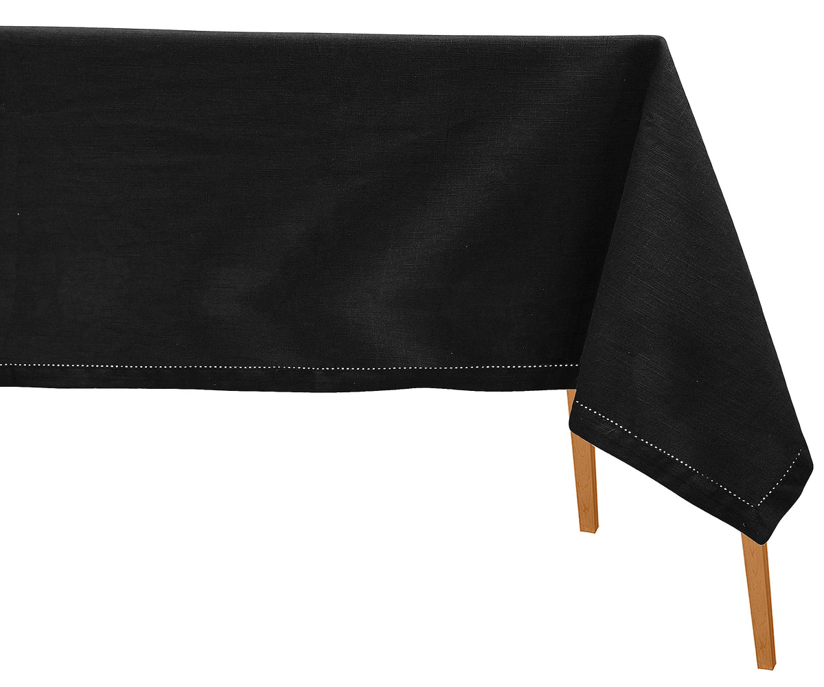 Black tablecloth on a wooden table with a white background Black tablecloth on a wooden table with a white background