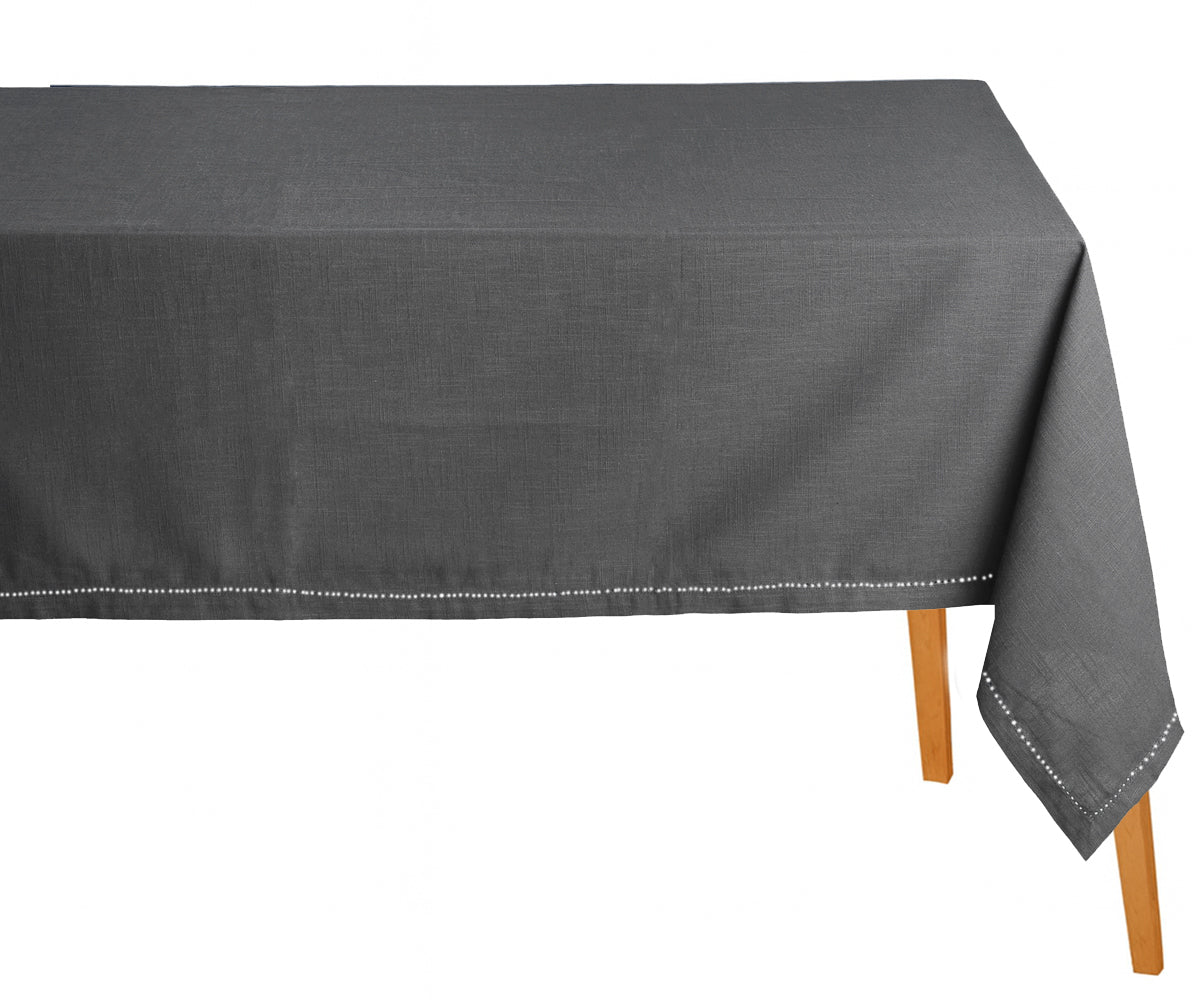 Gray tablecloth on a wooden table with a white background Gray tablecloth on a wooden table with a white background