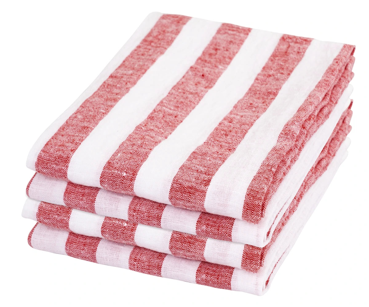 A set of 4 linen napkins, folded into simple rectangles, adding a touch of understated elegance to a casual outdoor dining setup. A set of 4 linen napkins, folded into simple rectangles, adding a touch of understated elegance to a casual outdoor dining setup.