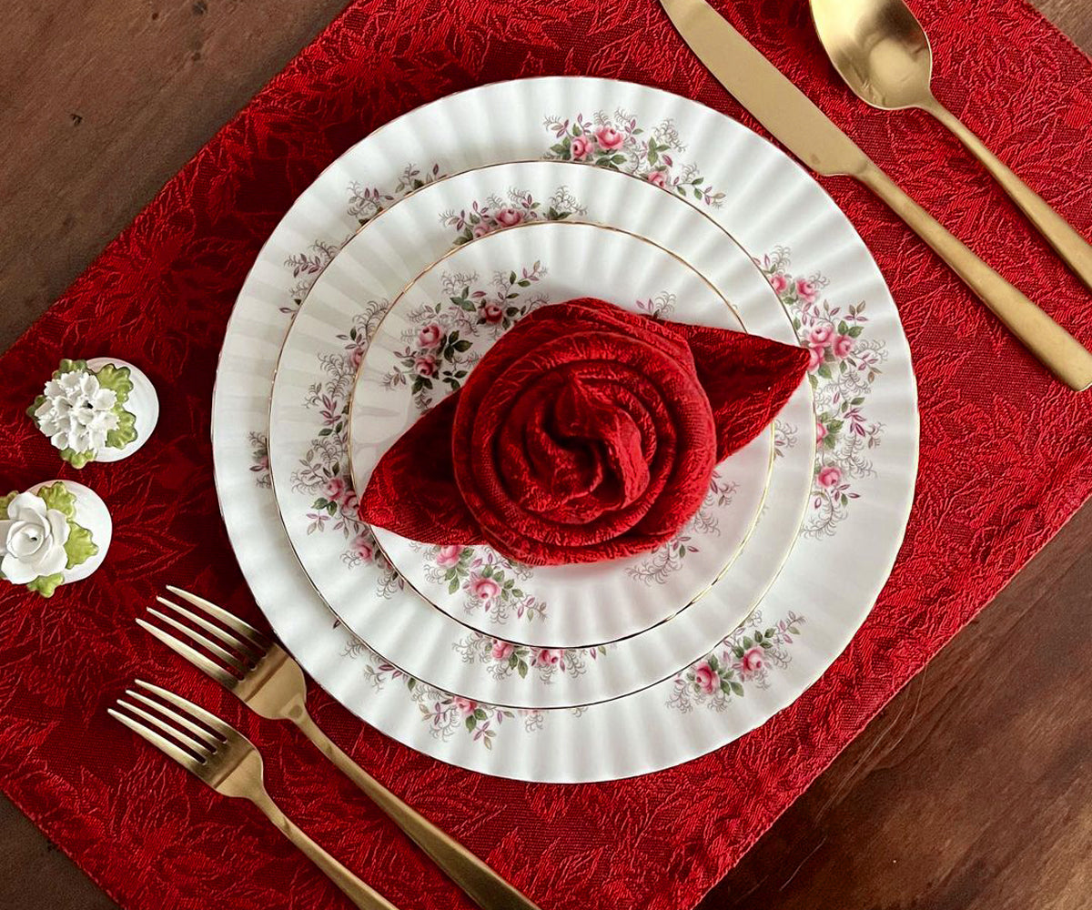 Add a touch of elegance to your table with these striking red fabric placemats, offering both style and protection. Add a touch of elegance to your table with these striking red fabric placemats, offering both style and protection.