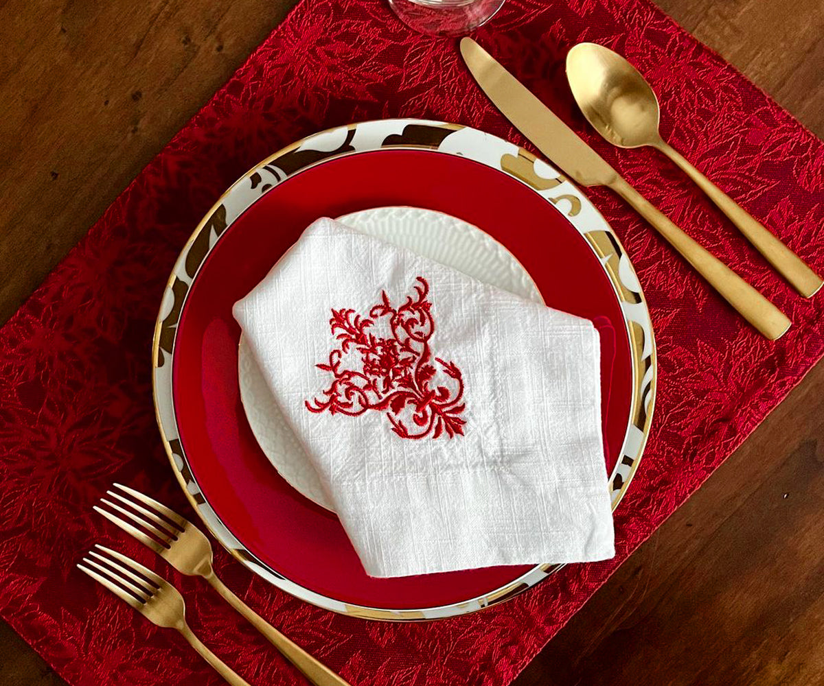 Enhance your dining table with vibrant red fabric placemats, combining elegance and protection for a delightful mealtime ambiance. Enhance your dining table with vibrant red fabric placemats, combining elegance and protection for a delightful mealtime ambiance.
