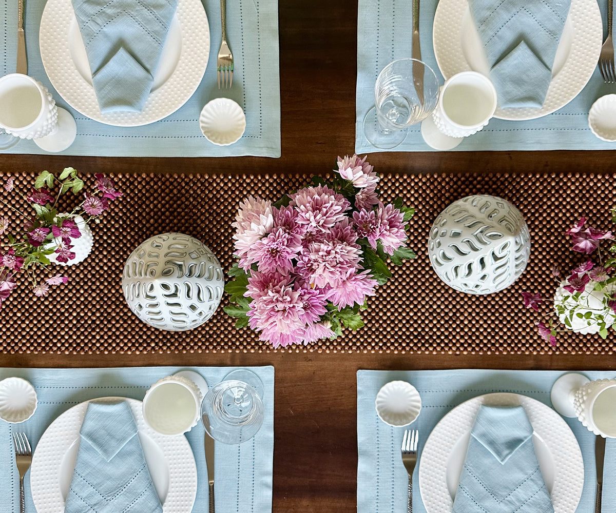 Elevate your dining table with green fabric placemats, providing charm and protection, creating a stylish and enjoyable mealtime expe Elevate your dining table with green fabric placemats, providing charm and protection, creating a stylish and enjoyable mealtime expe