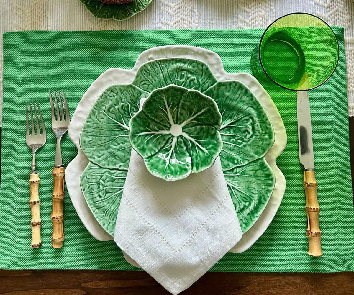 Add a touch of elegance to your table with these striking green fabric placemats, offering both style and protection.