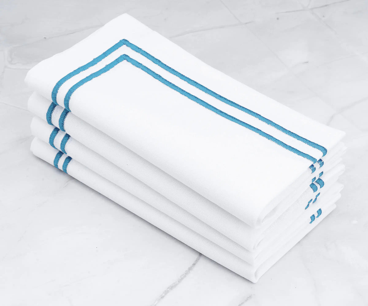 A touch of serenity White napkins with light blue embroidered lines A touch of serenity White napkins with light blue embroidered lines