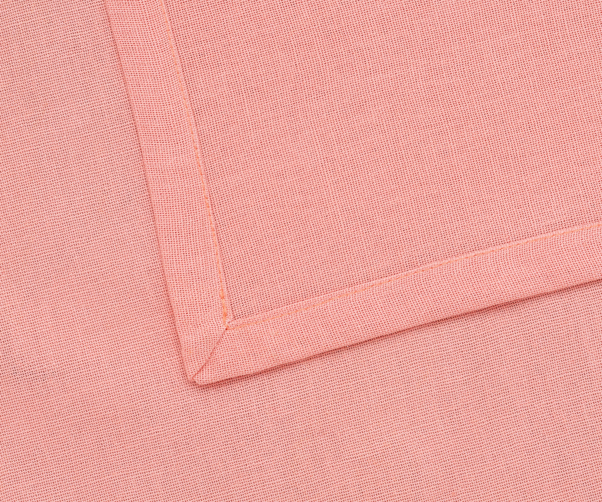 Reusable light pink cloth napkins styled with a floral centerpiece. Reusable light pink cloth napkins styled with a floral centerpiece.