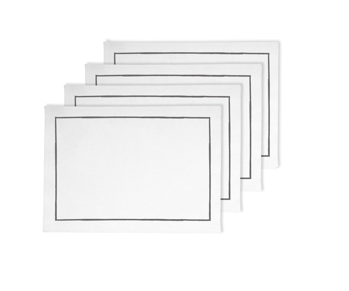 White cotton placemats with gray line embroidery, 13x18 inches, available in sets of 4 and 8. White cotton placemats with gray line embroidery, 13x18 inches, available in sets of 4 and 8.