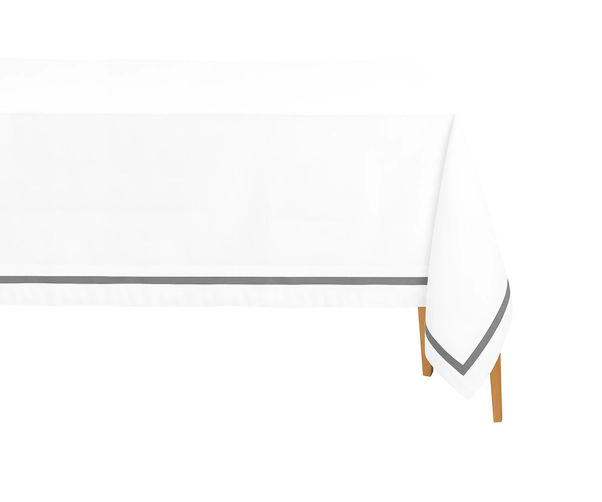 White rectangle cotton tablecloth with grey satin finish on dining table, styled for wedding décor. White rectangle cotton tablecloth with grey satin finish on dining table, styled for wedding décor.