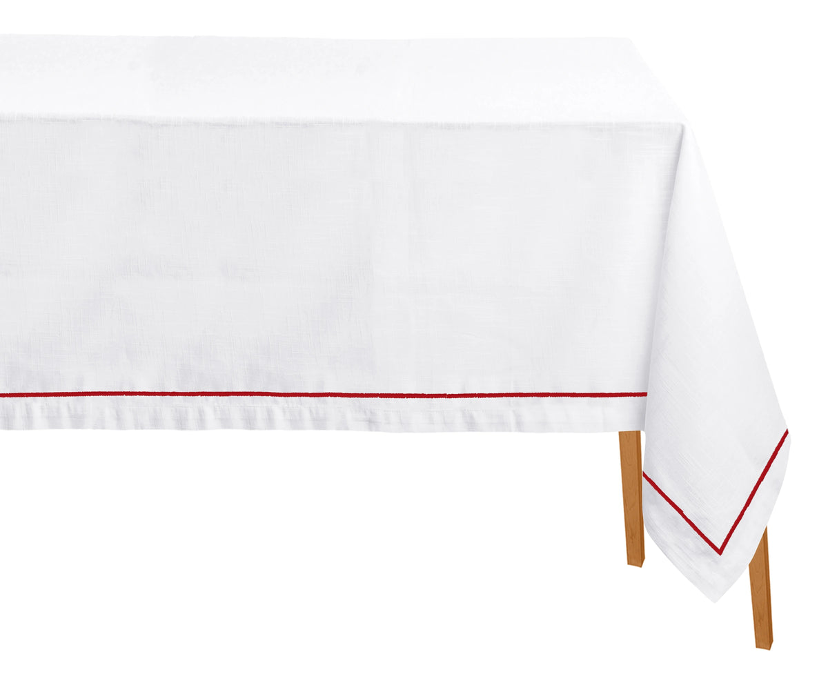 Magenta embroidered cotton rectangle tablecloth displayed on a dining table Magenta embroidered cotton rectangle tablecloth displayed on a dining table