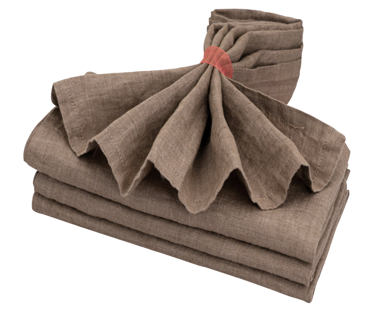 Beige linen napkins exude classic elegance with their soft texture and understated charm.  Beige linen napkins exude classic elegance with their soft texture and understated charm.