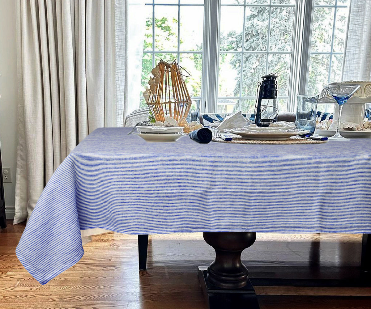 Blue and white stripe tablecloth offering a classic and timeless look. Blue and white stripe tablecloth offering a classic and timeless look.