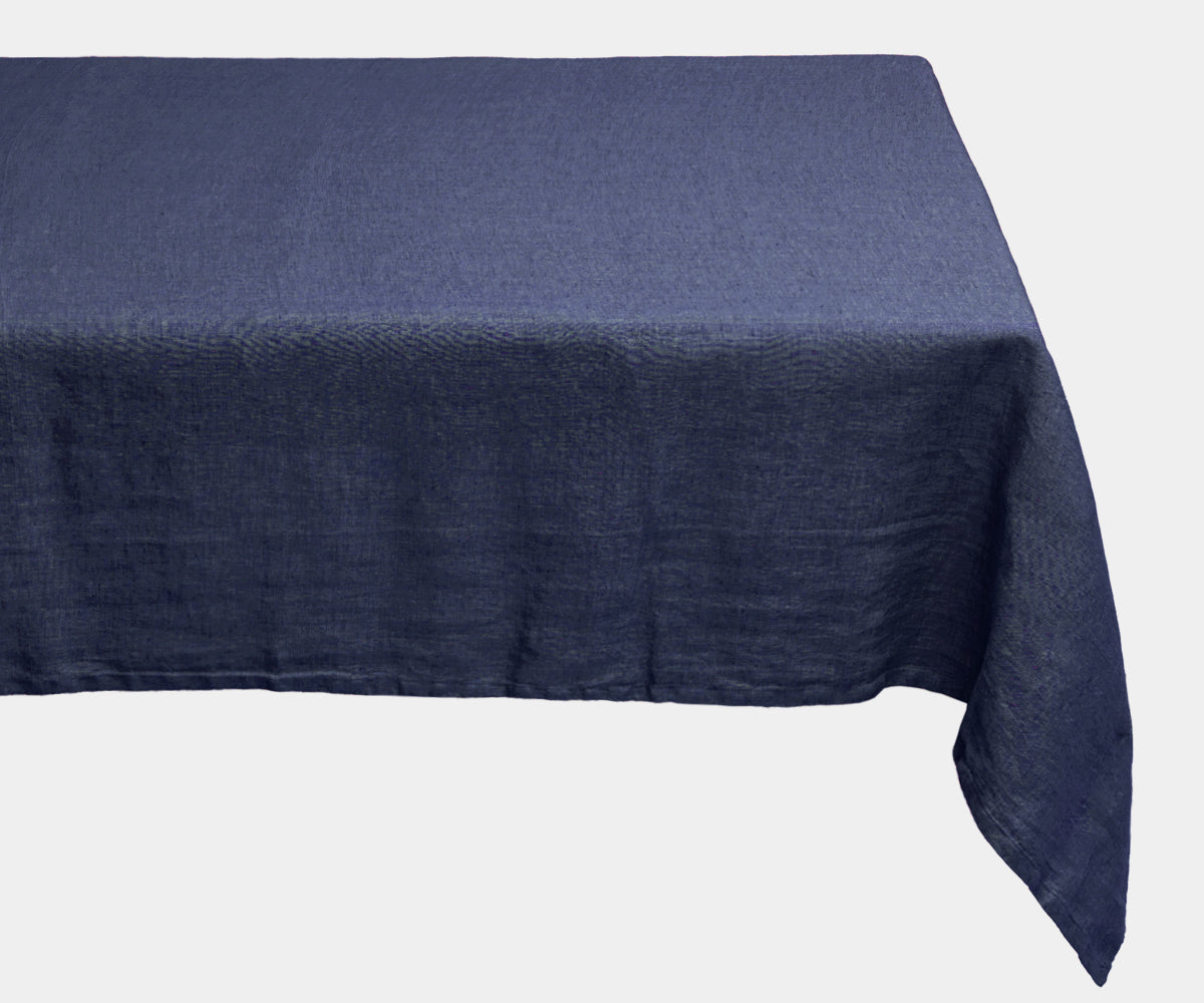 A rectangular tablecloth in classic linen material. Elegant blue tablecloth for a vibrant table setting. A rectangular tablecloth in classic linen material. Elegant blue tablecloth for a vibrant table setting.